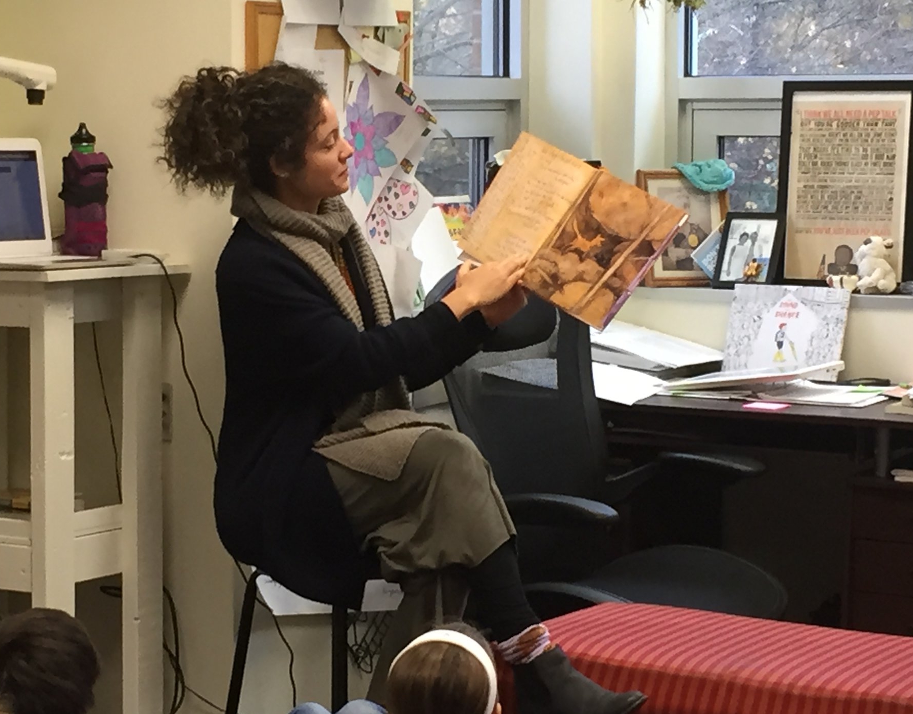  Gabby reading  Fox  aloud to the students in preparation for our text-based debate. 